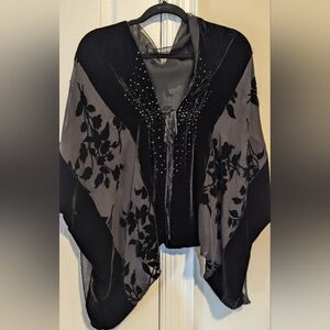 Black floral velvet wrap with beaded front and tie closure.